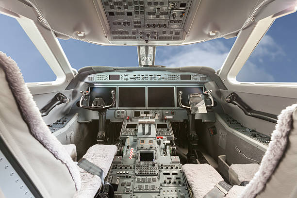Inside view Cockpit Airplane Aircraft with blue sky and clouds